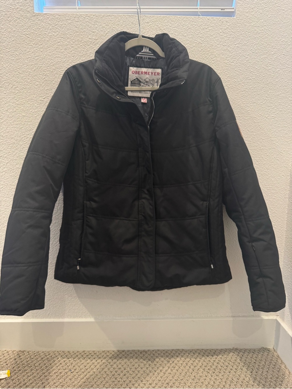 Obermeyer insulated zip-up puffer jacket with a high collar